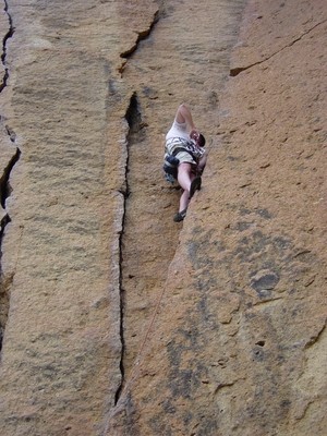 Joel Hass grabbing a cam on Cinnamon Slab - Trad Climb