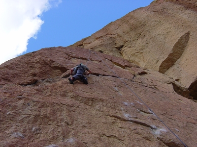 Dane Traversing Scorpian Crack, an unnamed 5.10b - Christian Brothers - Smith Rock - Climbing Oregon