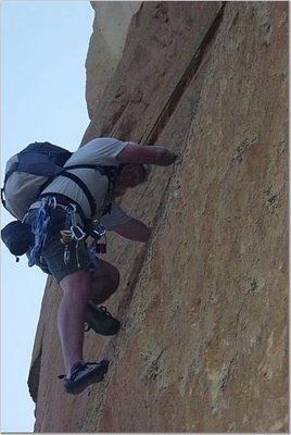 Jody O'Donnell pulling up the crack of West Face Variation - Smith Rock - Trad Climb