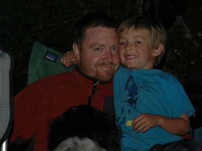 Tanis ODonnell and dad getting snuggle time at the campfire